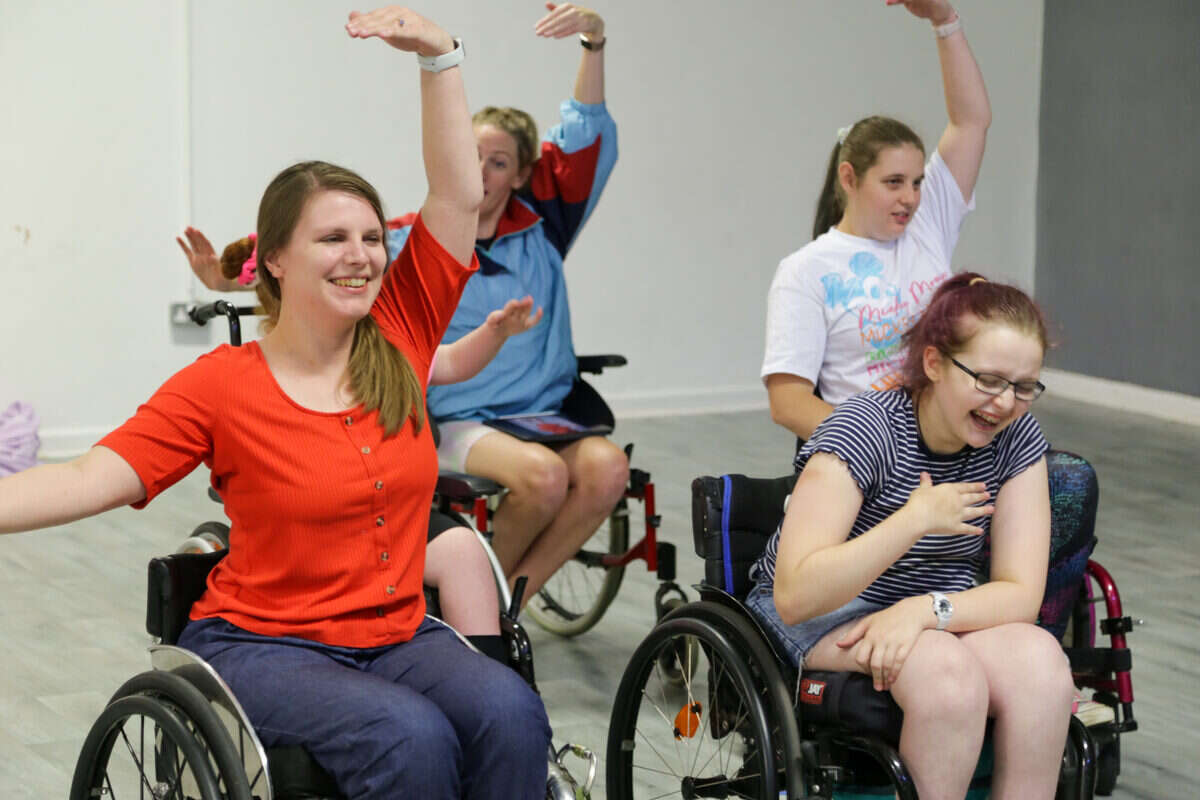 Wheelchair dancers rehearsing together in a studio